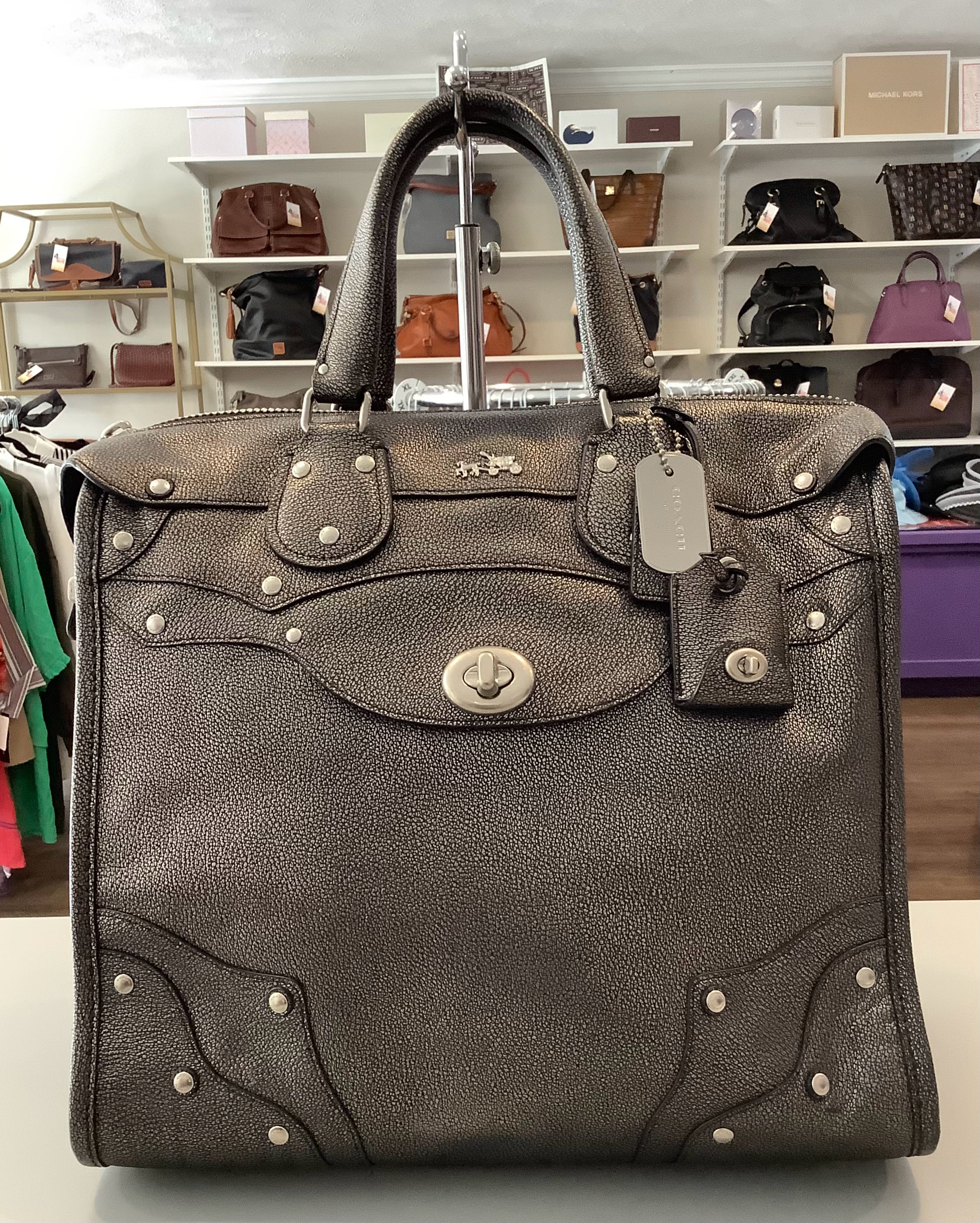 Coach leather store Rhyder purse